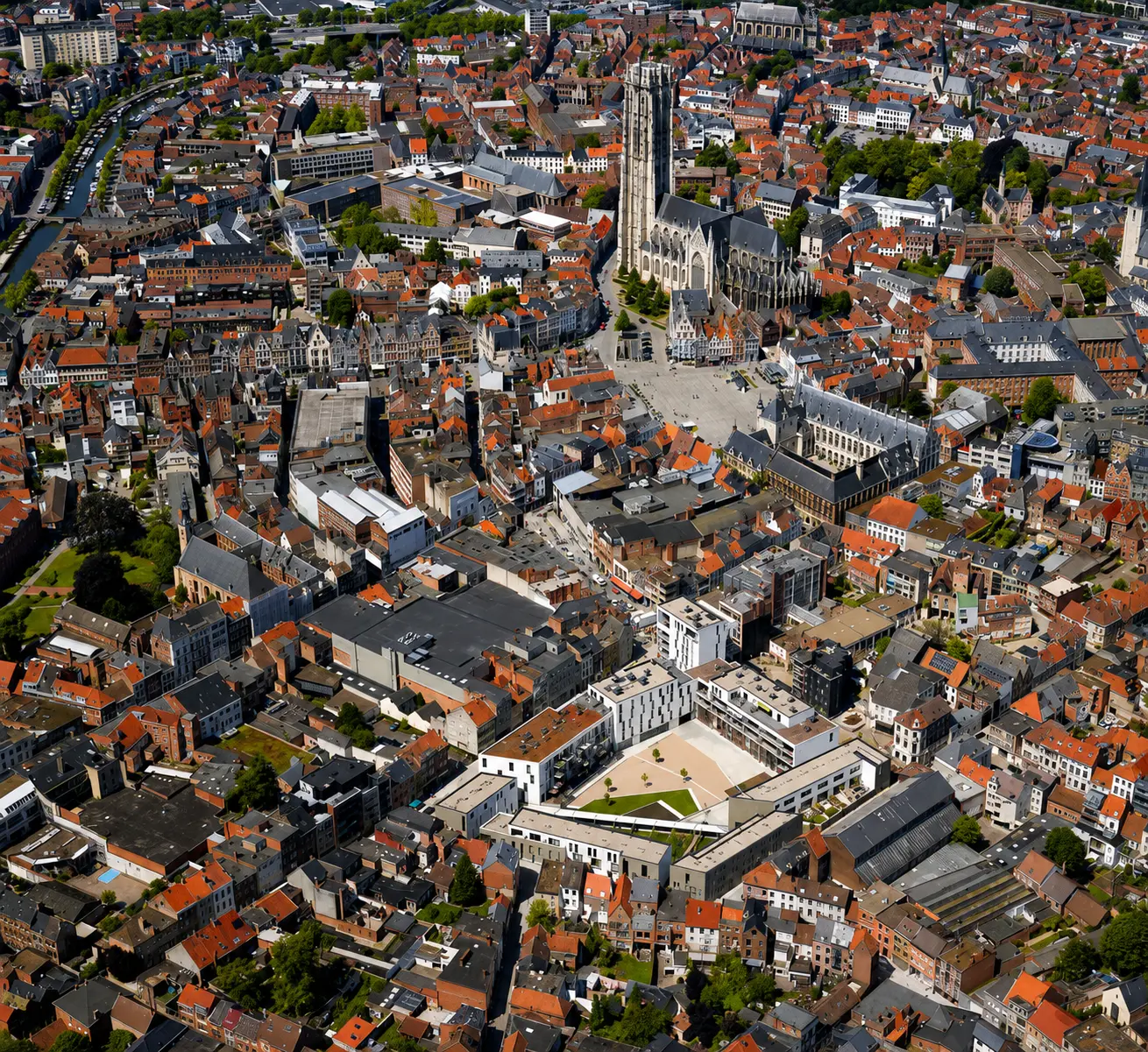 Aerial view of the completed Het Clarenhof development within the wider urban fabric of Mechelen.